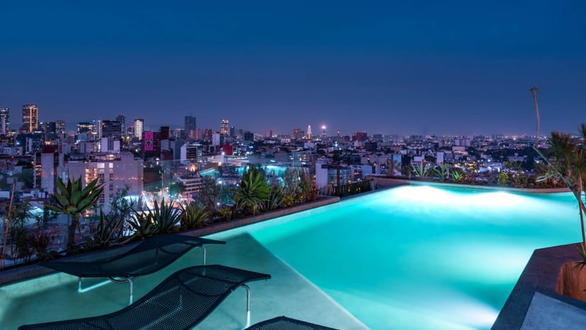 Rooftop infinity pool venue for upscale corporate cocktail reception and VIP event.
