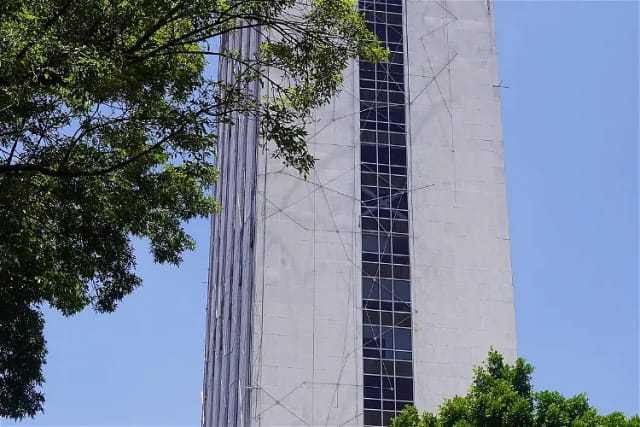 Tlatelolco University Cultural Center high-rise venue with floor-to-ceiling windows for events.