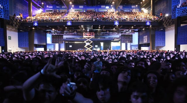 Crowded Pepsi Center concert hall during a sold-out live music event.