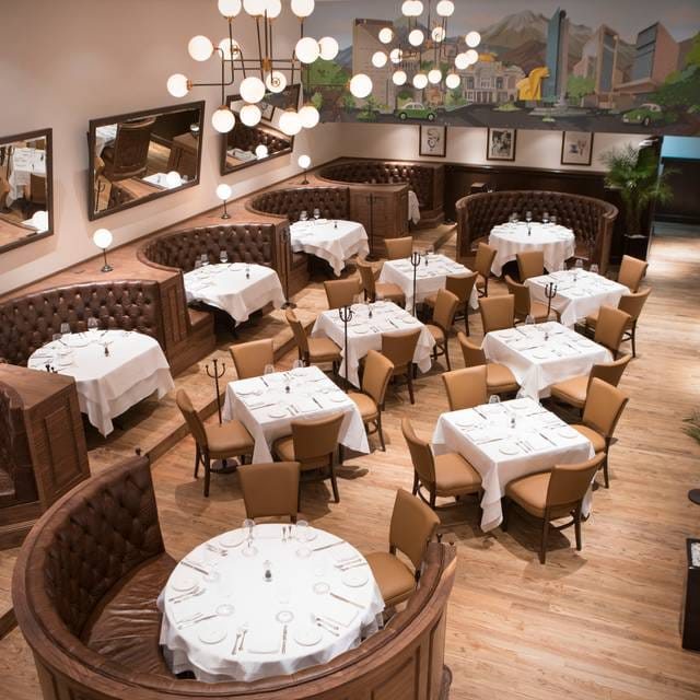 High-end restaurant dining room with banquette seating for corporate events and luxury galas.