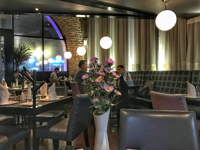 Eloise Chic Cuisine dining room with plush seating for business dinners and networking events.