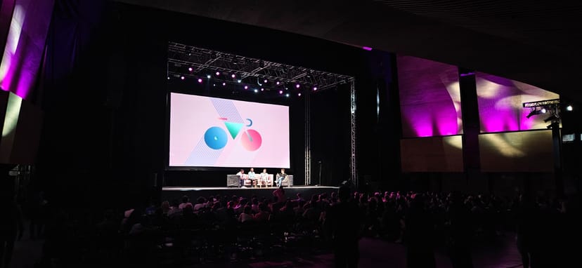 Auditorio BB stage with lounge seating for panel discussion events and corporate presentations.