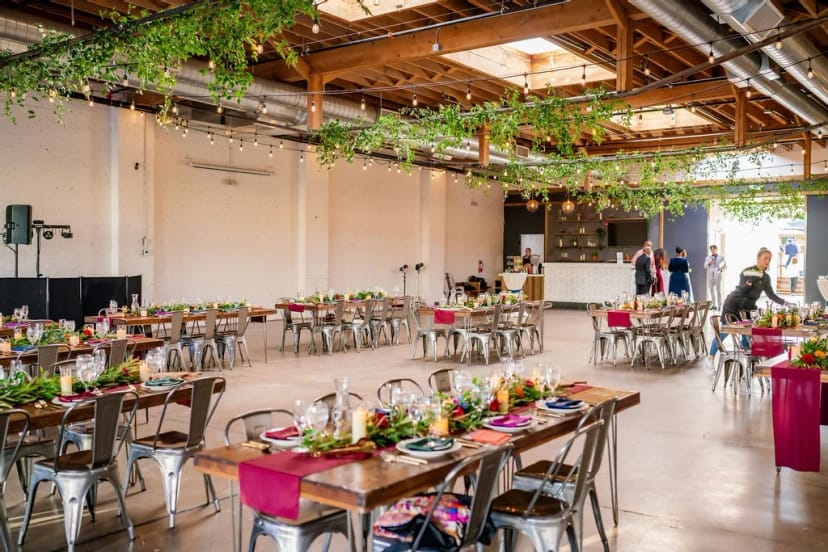 Industrial chic Skylight event venue with bohemian banquet seating for weddings and galas.