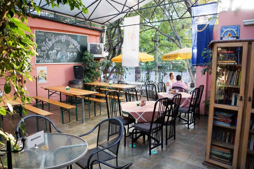 Club Alemán restaurant with garden seating, ideal for networking events and social mixers.