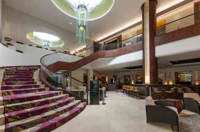 BelAir Unique hotel lobby with sweeping staircase for corporate events and conference registration.