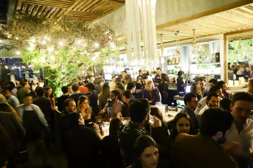 Fiera Rooftop indoor reception: warm lighting and organic decor for corporate networking events.