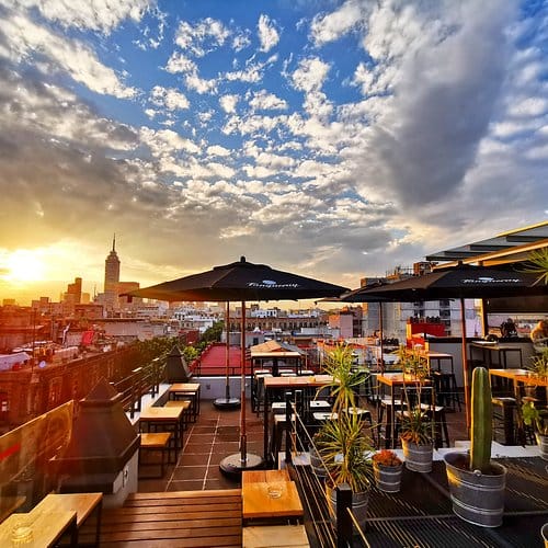 Antisocial Rooftop bar at sunset, ideal for upscale networking events and city skyline cocktails.