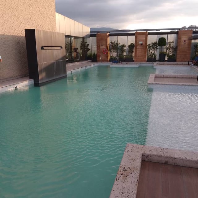 Upscale multi-level rooftop pool lounge for corporate incentive trips and networking events.