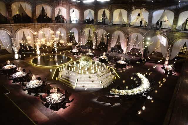 Ex Convento San Hipólito gala hall with dramatic lighting and elegant drapery for luxury events.
