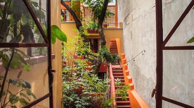 Red Tree House suite breakout space featuring an open staircase for intimate event planning.