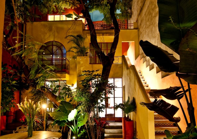 Intimate courtyard venue with warm lighting for cocktail receptions and private events.