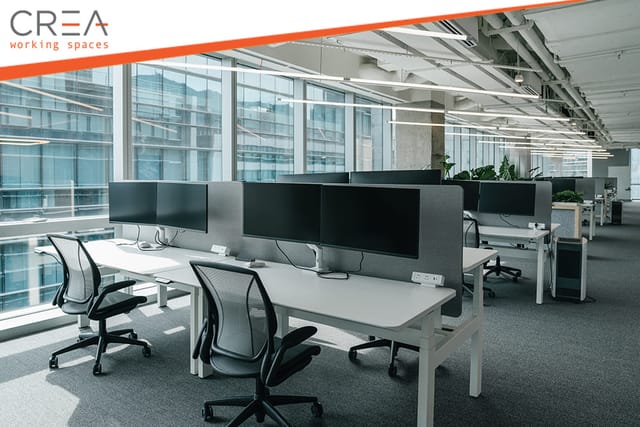 Modern coworking workspace with ergonomic desks for solo focus and professional productivity.