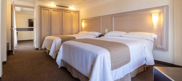Double-occupancy hotel room in Marbella Mexico for event lodging and group travel.