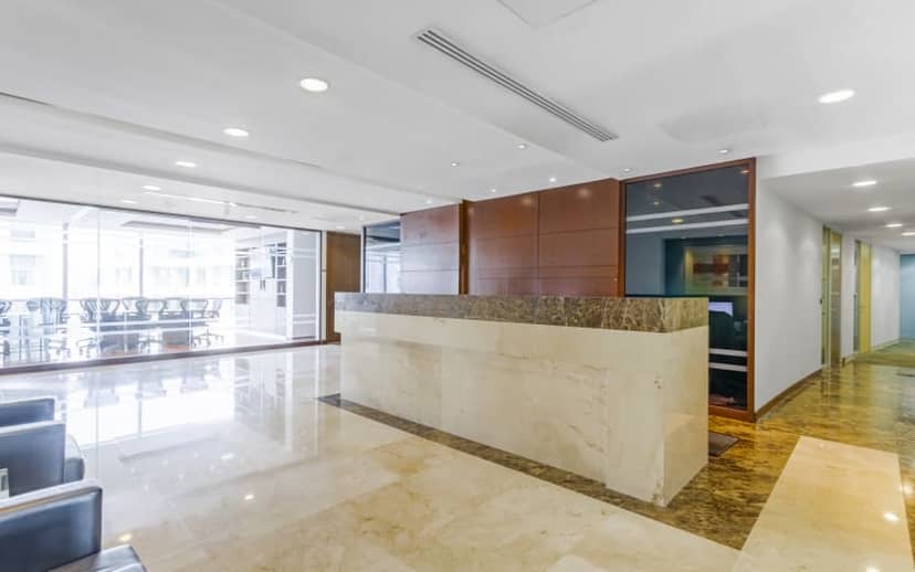 Modern coworking reception and conference room for professional event registration and check-in.