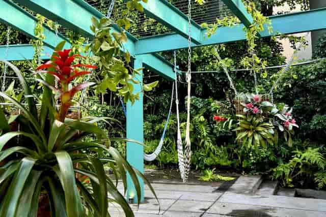 LagoAlgo outdoor patio with hanging chairs, perfect for corporate networking and event spaces.