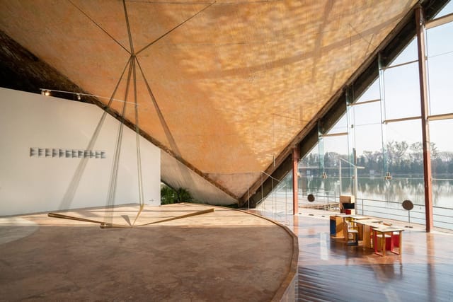Minimalist stage at LagoAlgo cultural center for exclusive gallery events and product reveals.