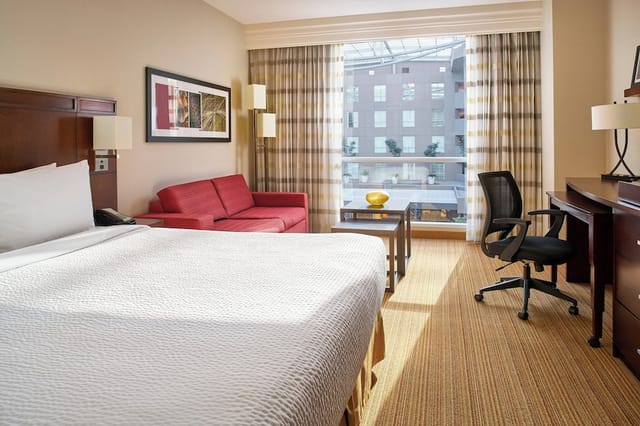 Modern Coyoacan hotel room with workspace, ideal for business meetings and corporate events.