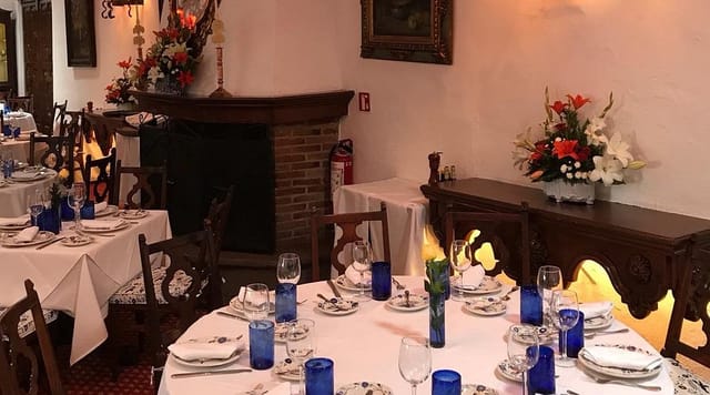 San Angel Inn private dining room with blue glassware for corporate dinner or rehearsal events.