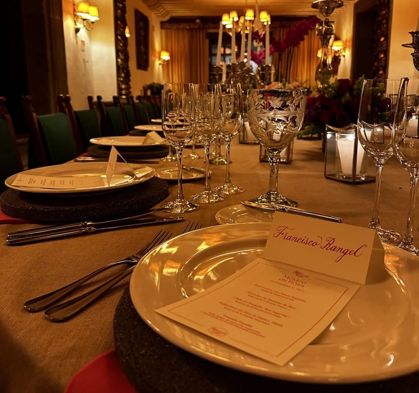 Upscale gala dinner tablescape with elegant place settings for formal events.