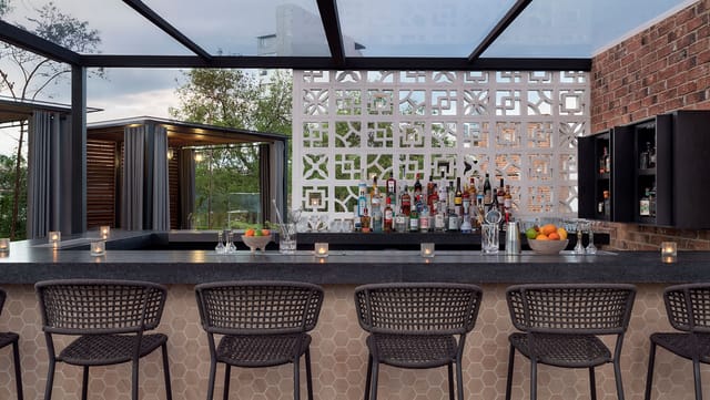 XKINA Rooftop bar, elegant outdoor setting for networking receptions and corporate cocktail hours.