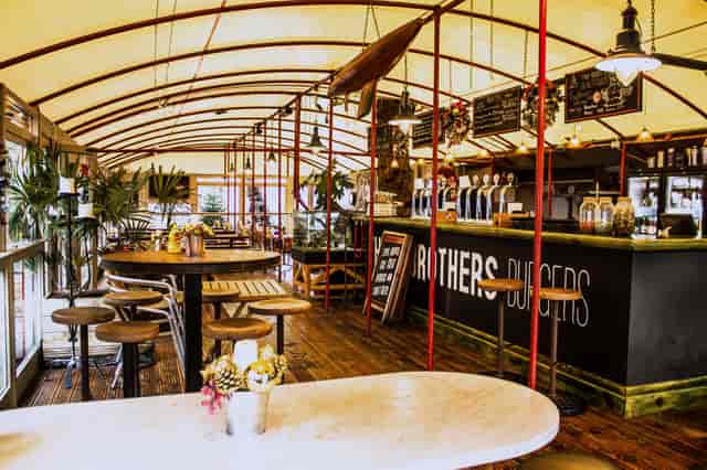 Industrial-chic burger restaurant event venue for networking and team-building mixers.