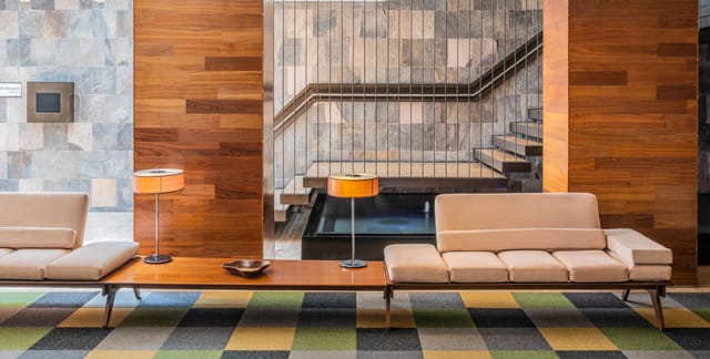The Paragon Hotel breakout space with wood accents, ideal for executive meetings and networking.