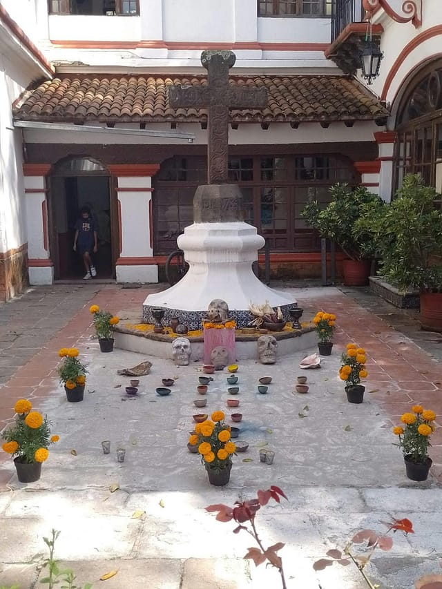 Day of the Dead courtyard installation at Casa de Cultura Jesús Reyes Heroles, cultural event.