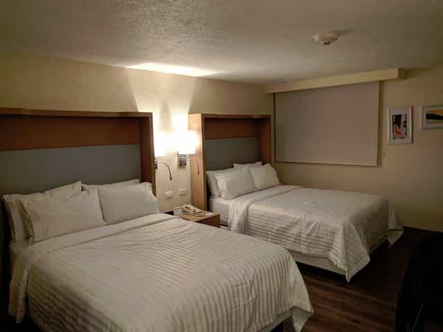 Double-queen hotel room at Holiday Inn Mexico Coyoacan for budget event housing.