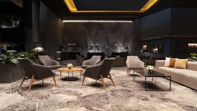 NH Collection Mexico City Airport T2 hotel lounge for corporate networking and business meetings.