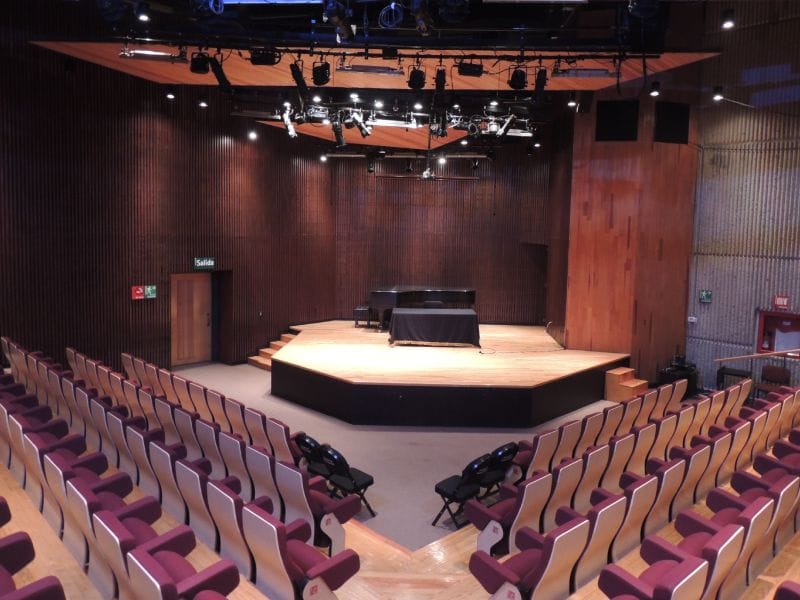 Sala Carlos Chávez auditorium with piano stage, ideal for intimate concerts and corporate events.