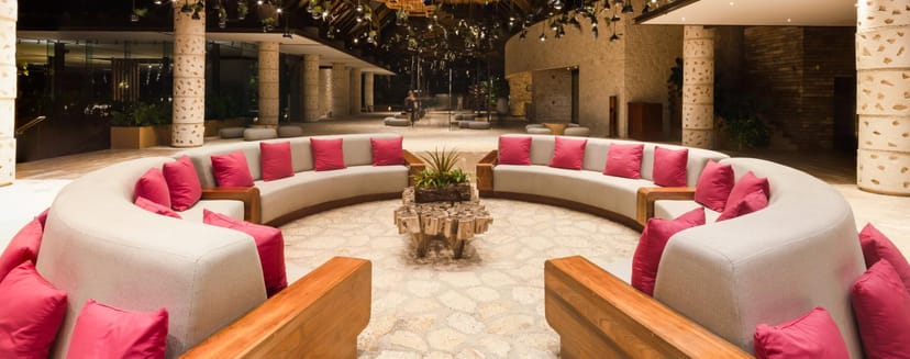 High-end outdoor networking lounge at Hotel Xcaret México for corporate events and conferences.