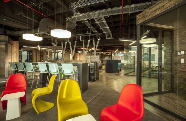 Modern Torre AXA breakout area for creative networking events and collaborative brainstorming.