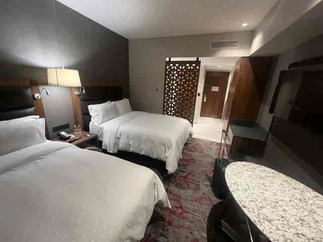 Double-queen hotel room at NOVELISTAS Fiesta Americana for business travel and event lodging.