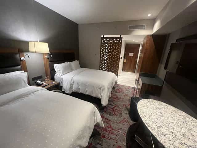 Double-queen hotel room at Fiesta Americana Mexico Satelite, ideal for business conference travel.