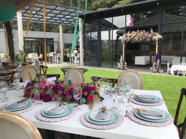 Elegant banquet hall with floral centerpieces, perfect for garden party and wedding reception venue.