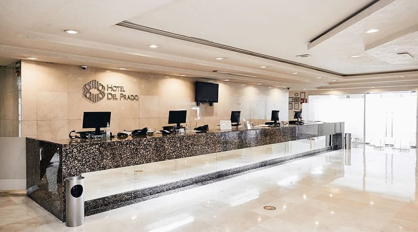 Versailles Room hotel reception desk for large event registration and group check-ins.