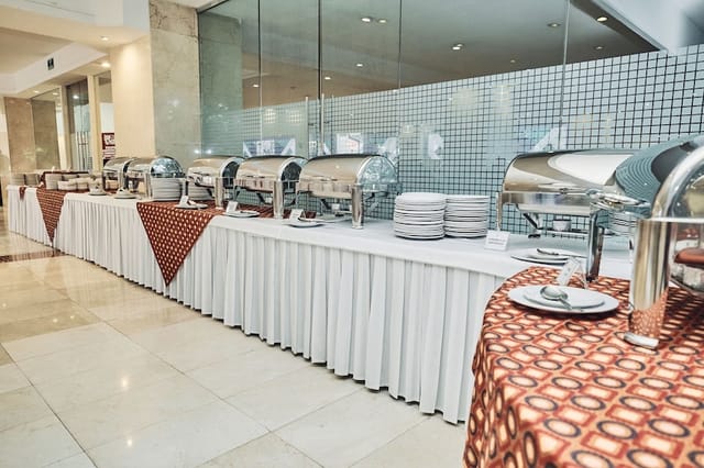 Hidalgo A Lounge buffet setup with professional chafing dishes for corporate catering and events.