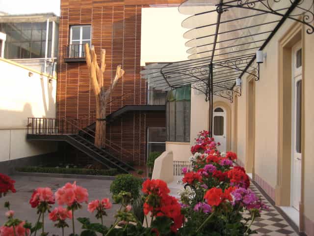 Boutique courtyard venue with central staircase for intimate wedding or event reception.