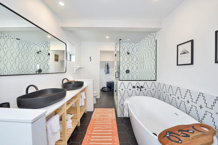 Luxury hotel bathroom with double vanity for executive retreats and site selection at Mystic Santa Fe.