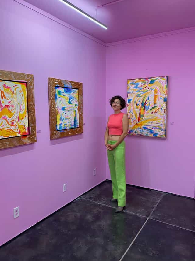 Art gallery reception with branded walls, ideal for corporate event hosting and exhibition spaces.