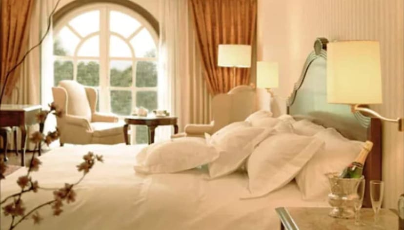 Upscale King Suite at The Green Park Hotel: elegant executive lodging and luxury event venue.