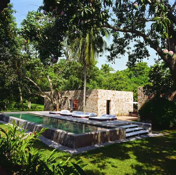 Maison Couturier poolside lounge for luxury corporate retreats and networking events.
