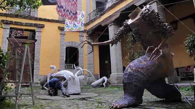 Cultural Center, Casa Talavera scenic load-in with large-scale art installations for event venue.