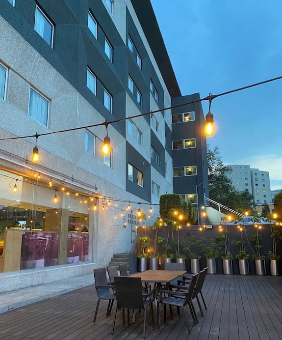 Ibis Mexico Perinorte outdoor evening networking reception with bistro lighting.