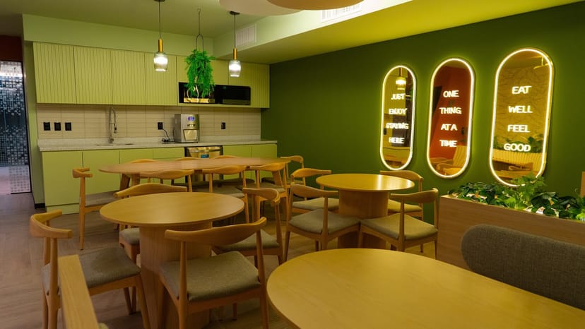 Private office breakout area with pantry for corporate team building and networking sessions.