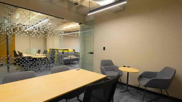 Modern private office with boardroom and lounge for collaborative coworking and networking events.