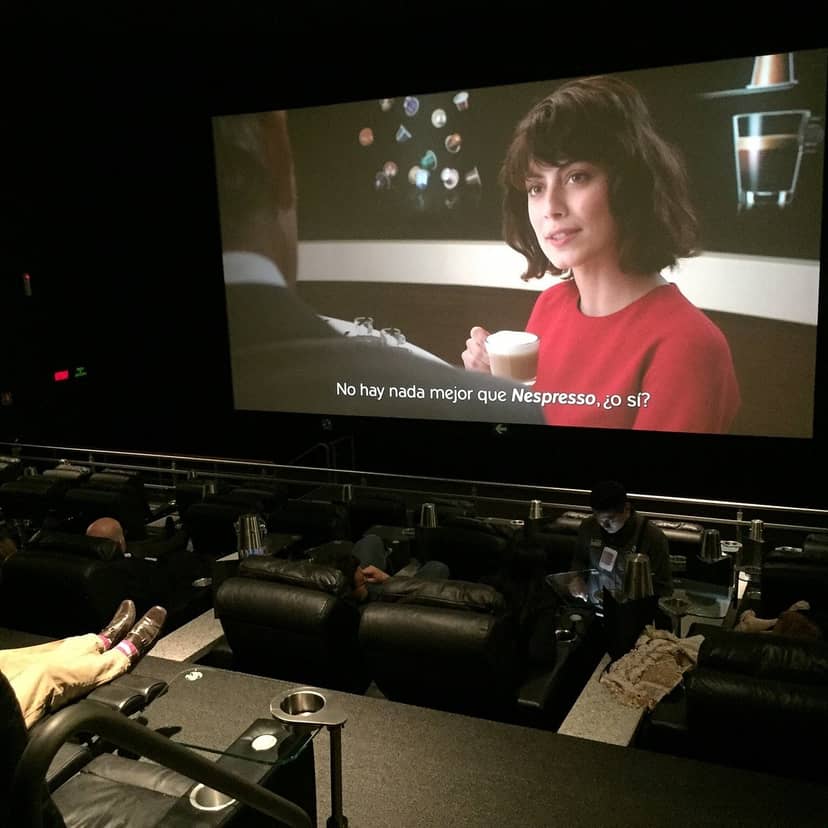 Cinema screen with subtitle sync error for professional AV event planning and production.
