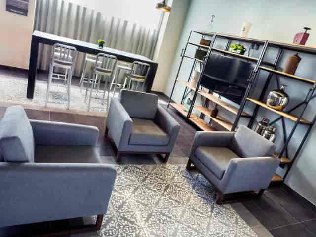 Modern lounge breakout space at City Express Plus Mexico City for business networking and events.
