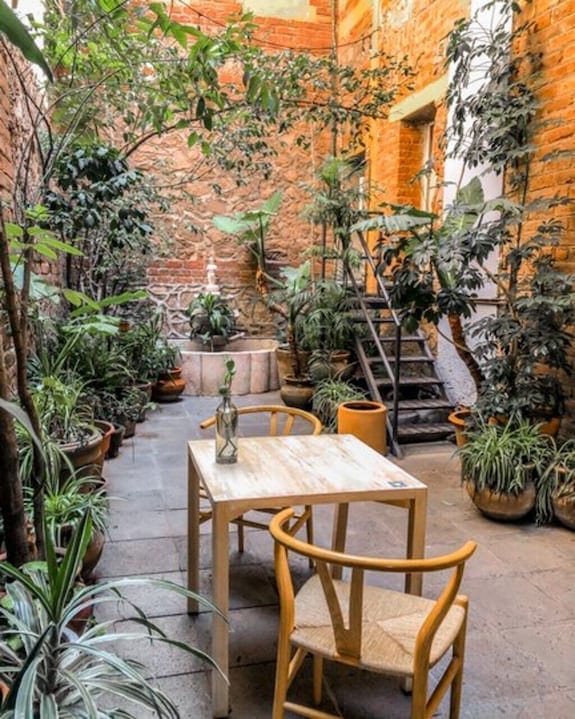 Boutique courtyard at El Patio 77 for intimate networking and corporate event breakout sessions.