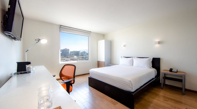 Minimalist Gamma Santa Fe hotel room for business meetings and corporate events.